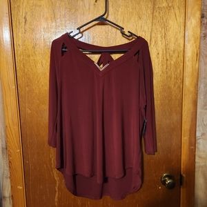 Cute burgundy blouse with cut out designs